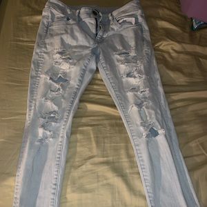 Light wash distressed denim jeans